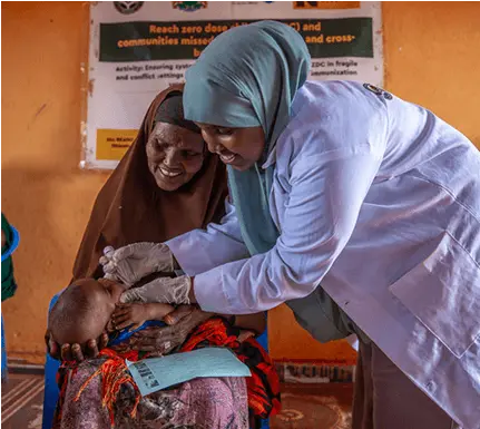 Healthcare worker vaccinating a child