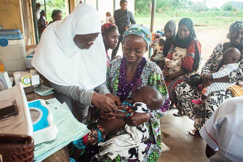 Community members celebrating vaccination milestone